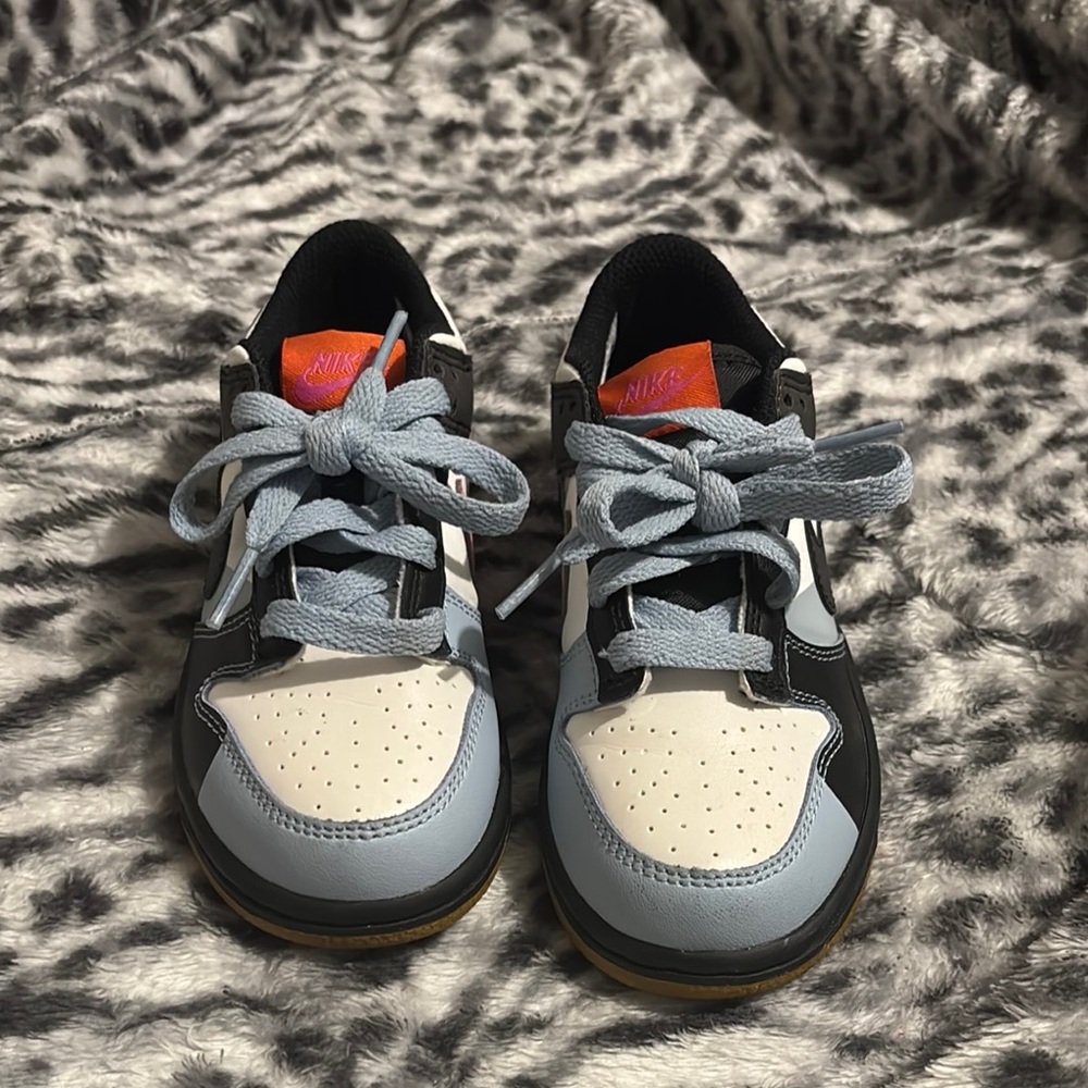 Nike Black and Blue Sneakers with Classic Silhouette